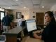 Hotel front desk staff warmly welcoming a guest at an independent boutique hotel