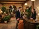 Well-dressed guest greeting concierge in a stylish boutique hotel lobby.